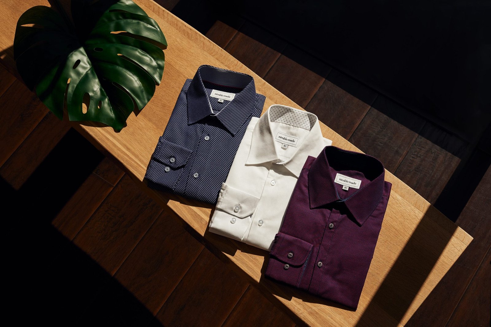 white button up shirt on brown wooden table